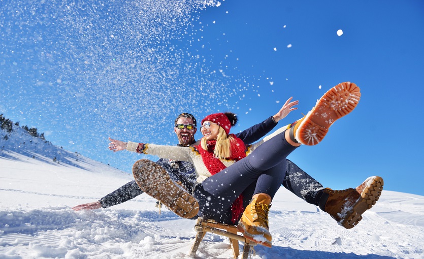 romantic winter scene, happy young couple having fun on fresh show on winter vacatio, mountain nature landscape